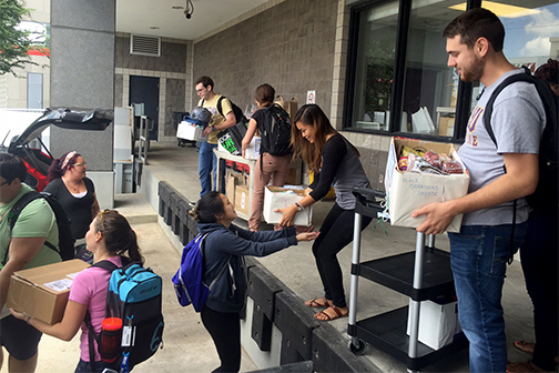 grad students delivering donations